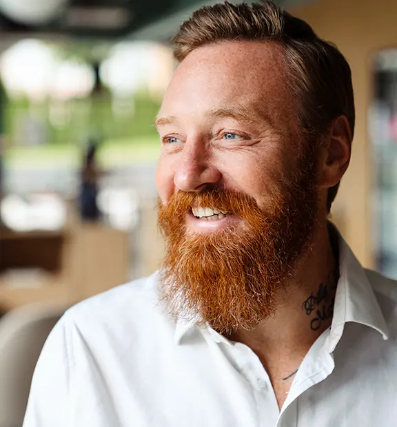 Smiling-man-mental-health-what-next-576x620